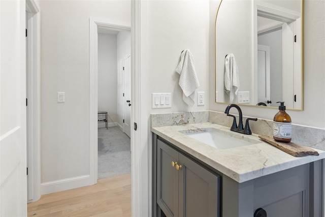 1724 Campus Corner Pl, Edmond, OK 73034 - bathroom with vanity and wood finished floors