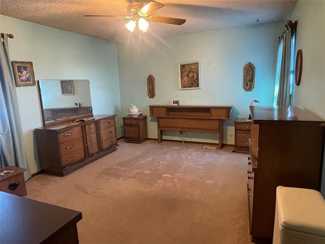 24400 Blackjack Rd, Perry, OK 73077 - bedroom featuring light colored carpet, a textured ceiling, and ceiling fan