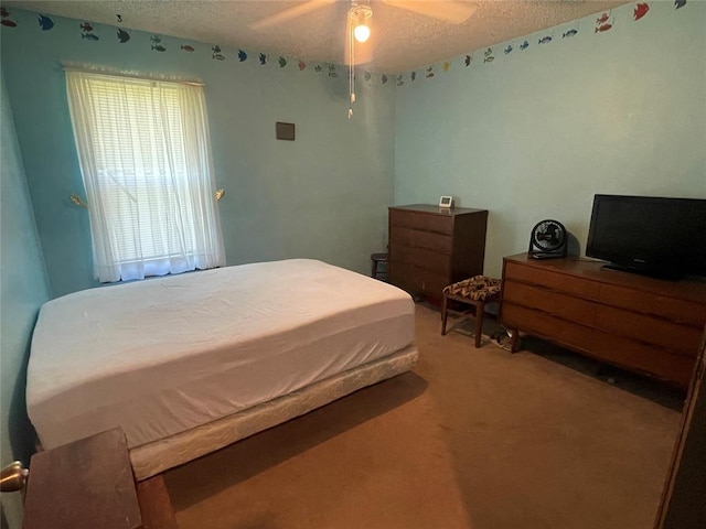 24400 Blackjack Rd, Perry, OK 73077 - bedroom with a textured ceiling, carpet, and a ceiling fan