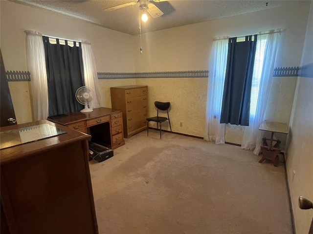 24400 Blackjack Rd, Perry, OK 73077 - bedroom featuring light carpet, a textured ceiling, and a ceiling fan