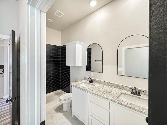 1101 N Tucker Ave, Shawnee, OK 74801 - full bathroom featuring double vanity, a stall shower, and marble finish floors