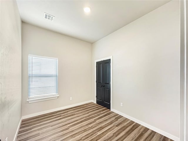 1101 N Tucker Ave, Shawnee, OK 74801 - spare room with wood finished floors and baseboards