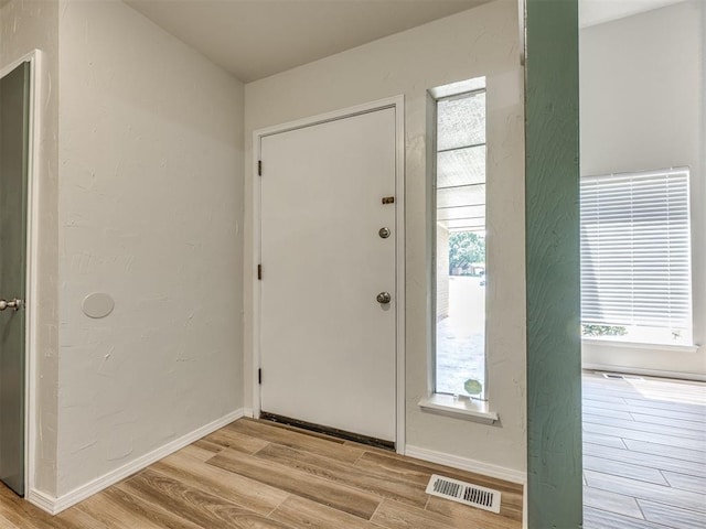 11516 N Barnes Ave, Oklahoma City, OK 73120 - foyer entrance with light wood finished floors and baseboards