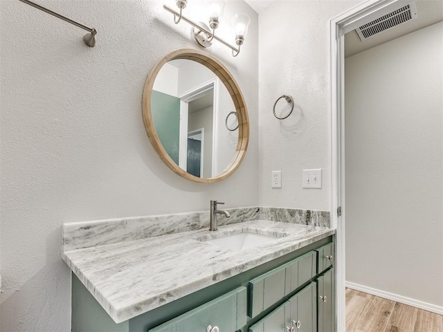 11516 N Barnes Ave, Oklahoma City, OK 73120 - bathroom with vanity and wood finished floors