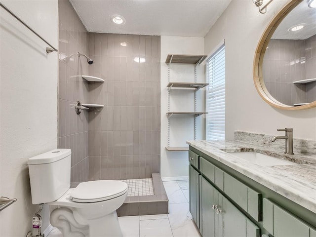 11516 N Barnes Ave, Oklahoma City, OK 73120 - full bath featuring vanity, tiled shower, and marble look tiles