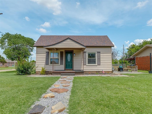 901 S 11th St, Kingfisher, OK 73750 - bungalow featuring roof with shingles and covered porch