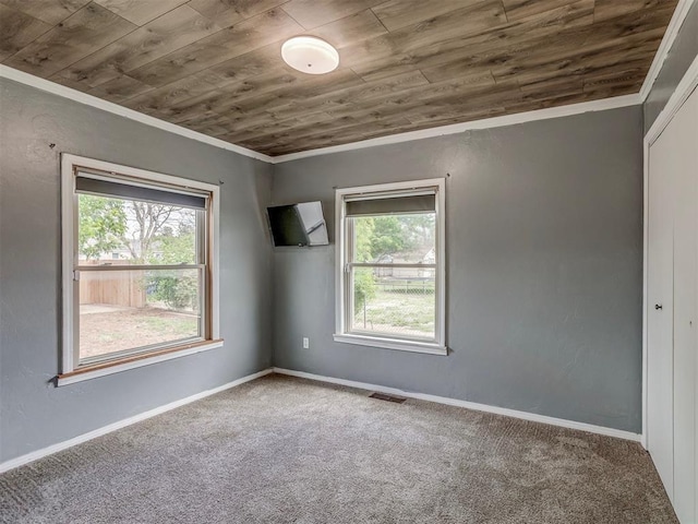 901 S 11th St, Kingfisher, OK 73750 - carpeted spare room featuring wood ceiling and crown molding