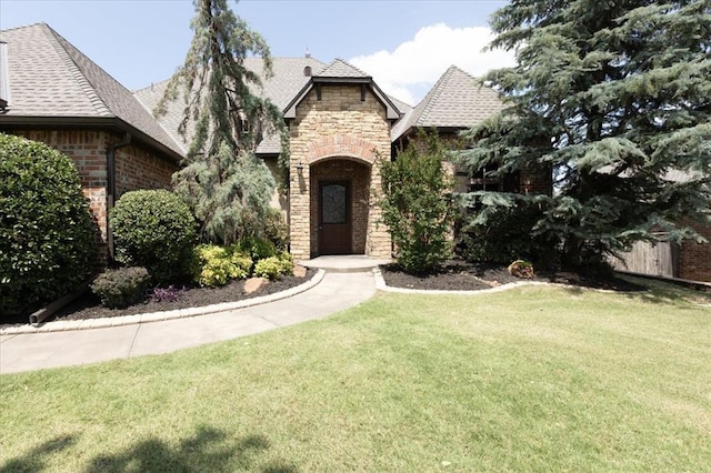 5000 Tower Bridge Court, Edmond, OK 73034 - view of front of property featuring stone siding, brick siding, and a shingled roof