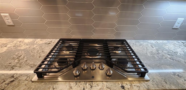 821 Mount Irving Way, Norman, OK 73071 - kitchen view of stainless steel gas stovetop and tasteful backsplash