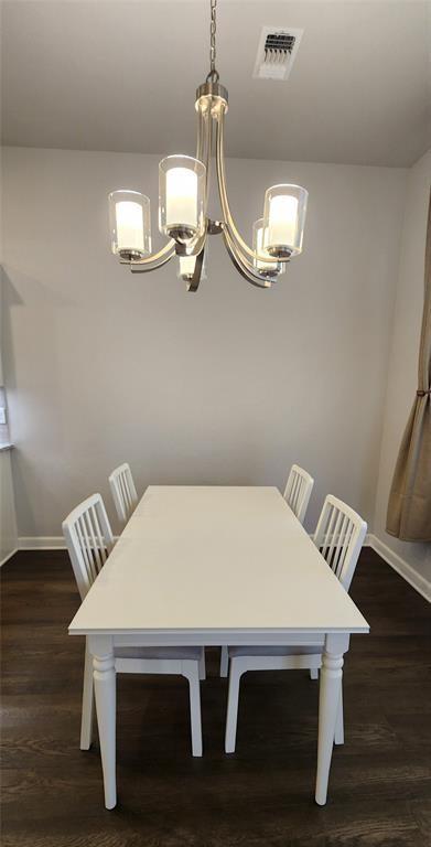 821 Mount Irving Way, Norman, OK 73071 - dining area with a chandelier and dark wood-style floors