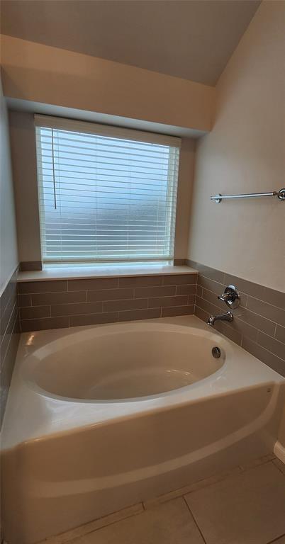 821 Mount Irving Way, Norman, OK 73071 - bathroom featuring a bath and tile patterned flooring