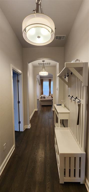 821 Mount Irving Way, Norman, OK 73071 - hallway with arched walkways and dark wood-style floors