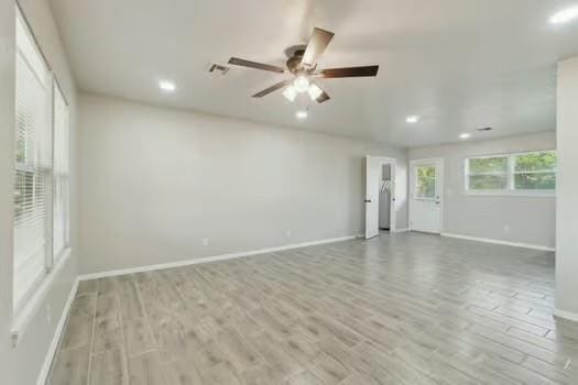 107 Cimarron Ter, Cashion, OK 73016 - spare room featuring wood finished floors, recessed lighting, and a ceiling fan