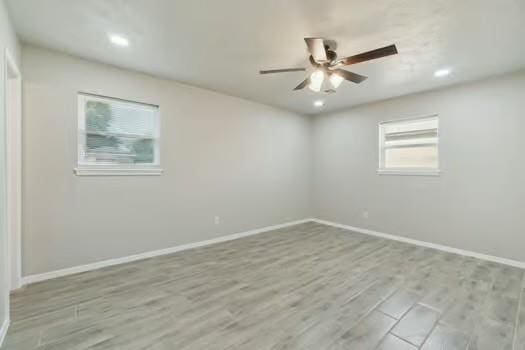 107 Cimarron Ter, Cashion, OK 73016 - empty room with a ceiling fan, wood finished floors, and recessed lighting