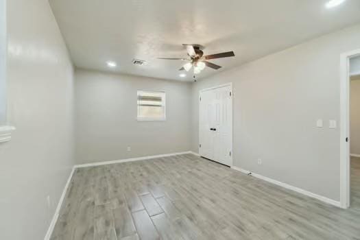 107 Cimarron Ter, Cashion, OK 73016 - unfurnished bedroom featuring wood finished floors, ceiling fan, and recessed lighting
