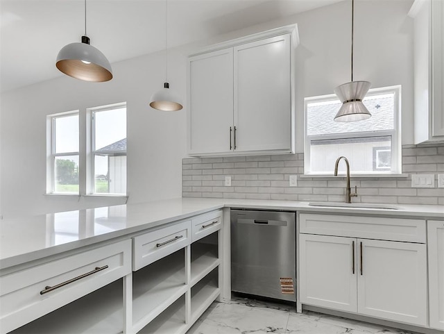 532 NW 112th St, Oklahoma City, OK 73114 - kitchen with stainless steel dishwasher, light marble finish floors, light countertops, white cabinetry, and tasteful backsplash