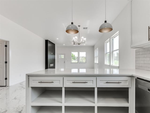 532 NW 112th St, Oklahoma City, OK 73114 - kitchen with dishwasher, light countertops, light marble finish floors, white cabinetry, and pendant lighting