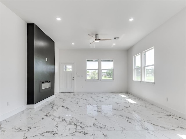 532 NW 112th St, Oklahoma City, OK 73114 - empty room featuring plenty of natural light, recessed lighting, ceiling fan, and light marble finish floors