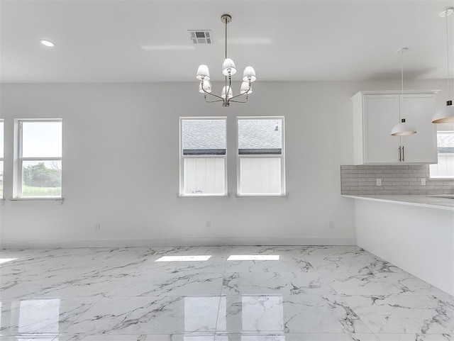 532 NW 112th St, Oklahoma City, OK 73114 - unfurnished dining area with recessed lighting, marble finish floors, and a chandelier