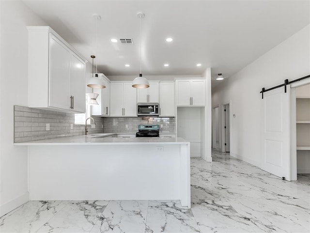 532 NW 112th St, Oklahoma City, OK 73114 - kitchen with stainless steel microwave, black range oven, light countertops, recessed lighting, and backsplash