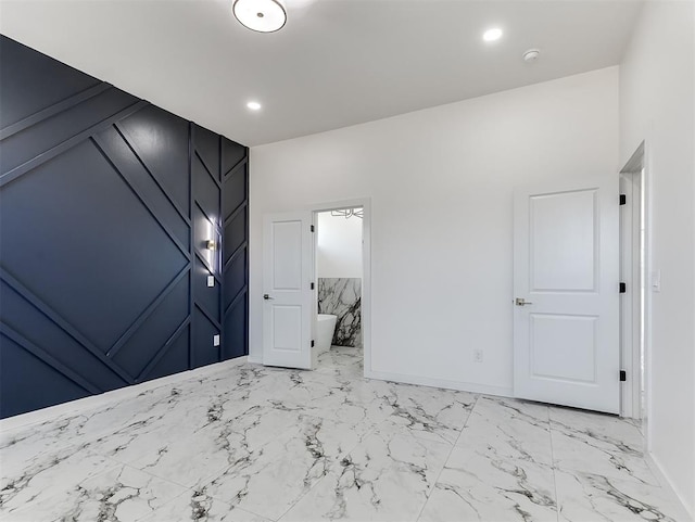 532 NW 112th St, Oklahoma City, OK 73114 - unfurnished bedroom with light marble finish flooring and ensuite bath