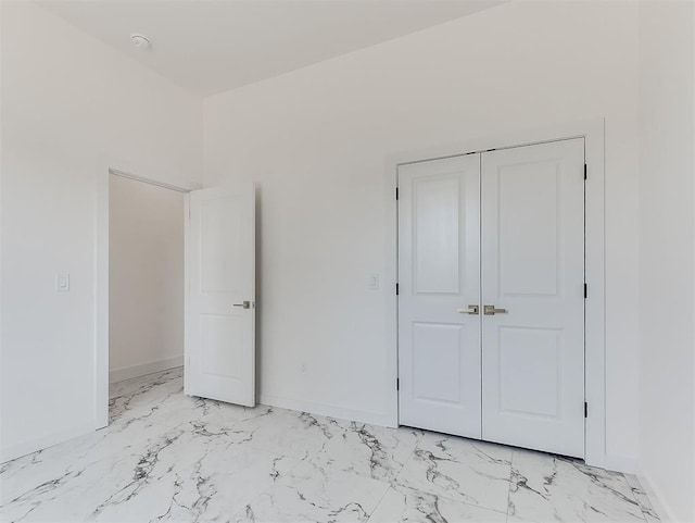 532 NW 112th St, Oklahoma City, OK 73114 - unfurnished bedroom with light marble finish flooring and a closet