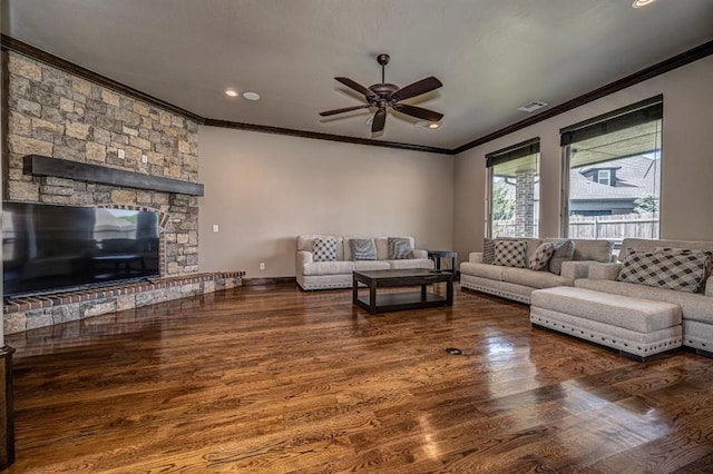 3205 Sycamore Dr, Moore, OK 73160 - living area with crown molding, a ceiling fan, wood finished floors, recessed lighting, and a fireplace