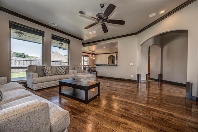 3205 Sycamore Dr, Moore, OK 73160 - living room with ornamental molding, arched walkways, wood finished floors, a ceiling fan, and recessed lighting