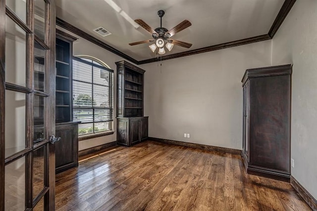 3205 Sycamore Dr, Moore, OK 73160 - spare room with ornamental molding, dark wood-style floors, and ceiling fan