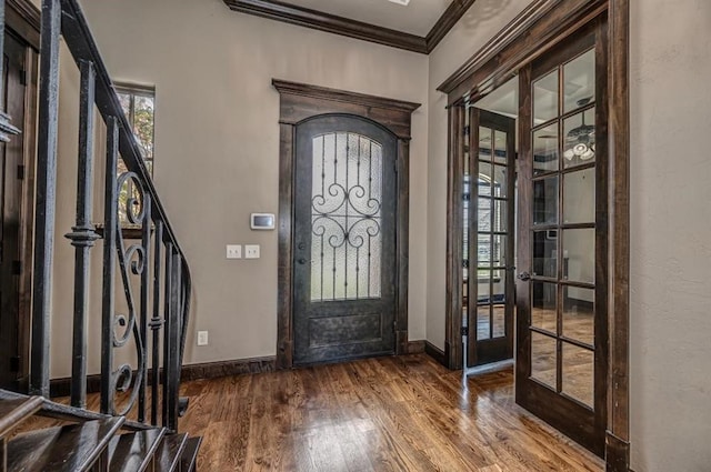 3205 Sycamore Dr, Moore, OK 73160 - entrance foyer featuring french doors, crown molding, wood finished floors, and stairs