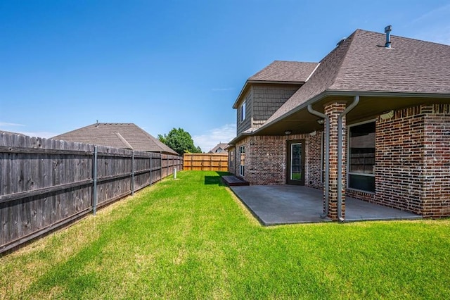 3205 Sycamore Dr, Moore, OK 73160 - fenced backyard with a patio area