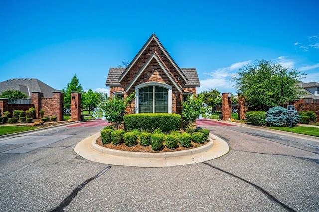 3205 Sycamore Dr, Moore, OK 73160 - view of front of property with a gate and brick siding