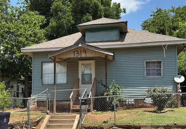 1317 NW 7th St, Oklahoma City, OK 73106 - view of front facade featuring roof with shingles