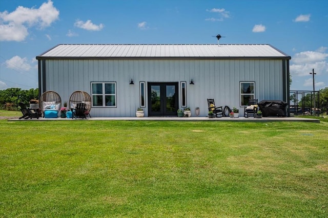831 County St Unit 2917, Tuttle, OK 73089 - rear view of property with french doors, a yard, and a metal roof