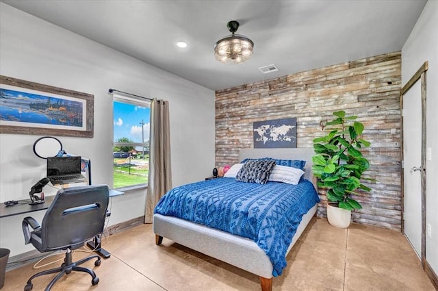 831 County St Unit 2917, Tuttle, OK 73089 - bedroom with an accent wall, a desk, wood walls, and recessed lighting