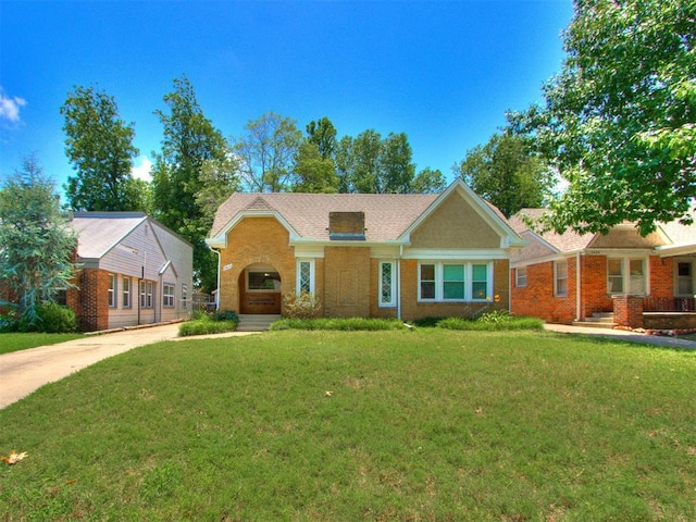 2420 NW 21st St, Oklahoma City, OK 73107 - ranch-style home with brick siding and a front lawn