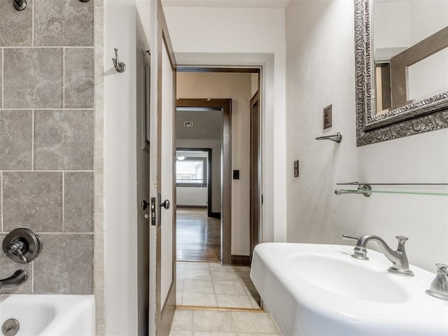 2420 NW 21st St, Oklahoma City, OK 73107 - bathroom with bathing tub / shower combination and a sink