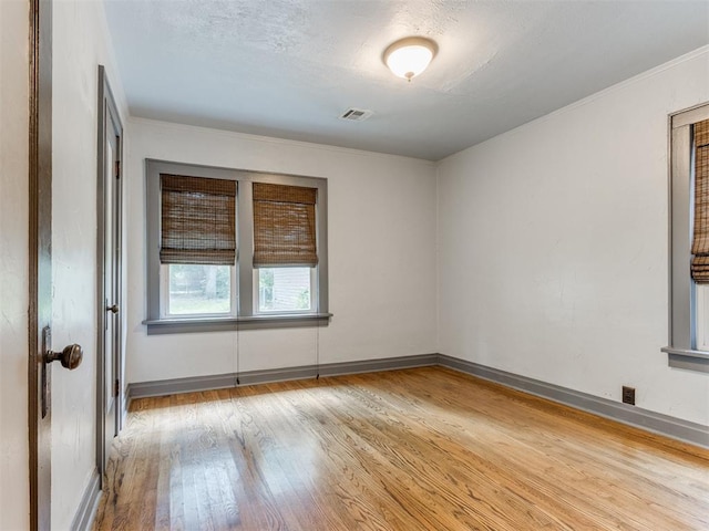 2420 NW 21st St, Oklahoma City, OK 73107 - unfurnished room featuring wood finished floors and crown molding