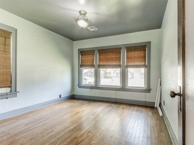 2420 NW 21st St, Oklahoma City, OK 73107 - spare room with plenty of natural light and wood finished floors