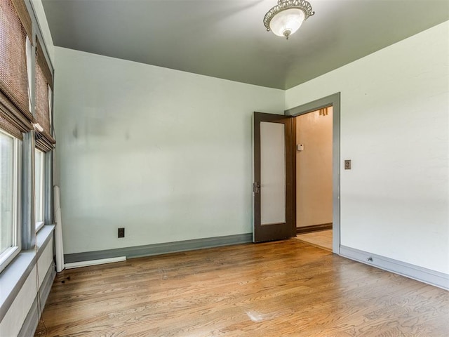 2420 NW 21st St, Oklahoma City, OK 73107 - unfurnished room with light wood-style floors and baseboards