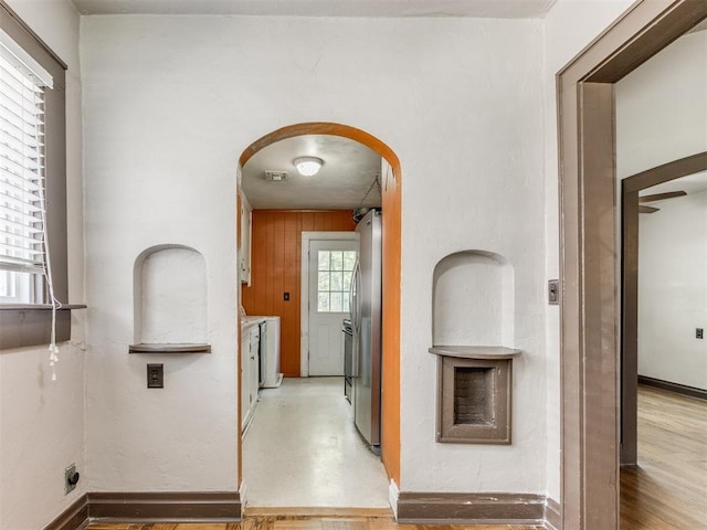 2420 NW 21st St, Oklahoma City, OK 73107 - hall featuring arched walkways and washing machine and dryer