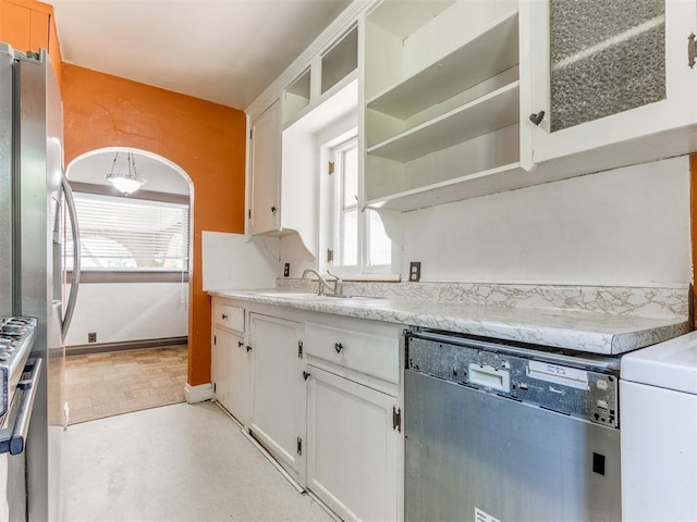 2420 NW 21st St, Oklahoma City, OK 73107 - kitchen featuring appliances with stainless steel finishes, plenty of natural light, white cabinets, and open shelves