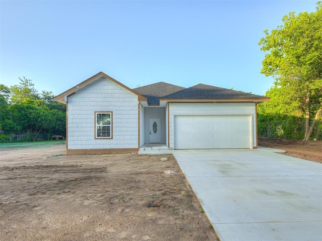 6410 NW 9th St, Oklahoma City, OK 73127 - single story home featuring an attached garage and driveway