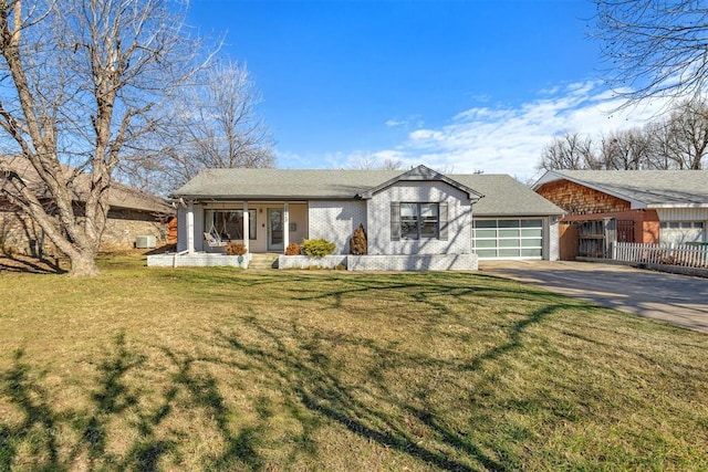 2523 NW 57th St, Oklahoma City, OK 73112 - ranch-style home with driveway, an attached garage, a porch, and brick siding
