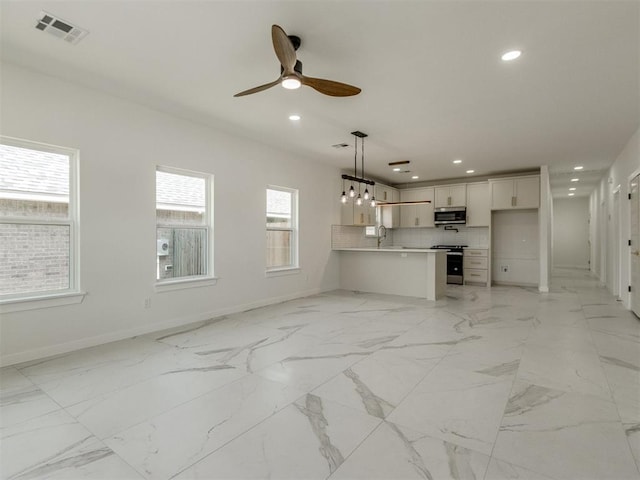 426 NW 115th St, Oklahoma City, OK 73114 - unfurnished living room featuring recessed lighting, a ceiling fan, and light marble finish floors
