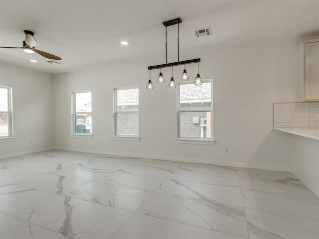 426 NW 115th St, Oklahoma City, OK 73114 - unfurnished dining area with light marble finish floors, ceiling fan, and recessed lighting
