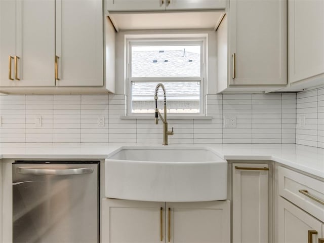 426 NW 115th St, Oklahoma City, OK 73114 - kitchen featuring dishwasher, light countertops, and decorative backsplash