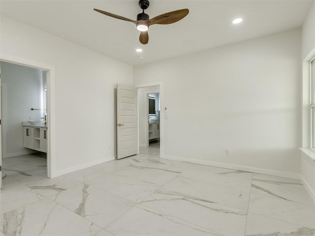 426 NW 115th St, Oklahoma City, OK 73114 - unfurnished bedroom featuring light marble finish flooring, recessed lighting, ensuite bath, and ceiling fan