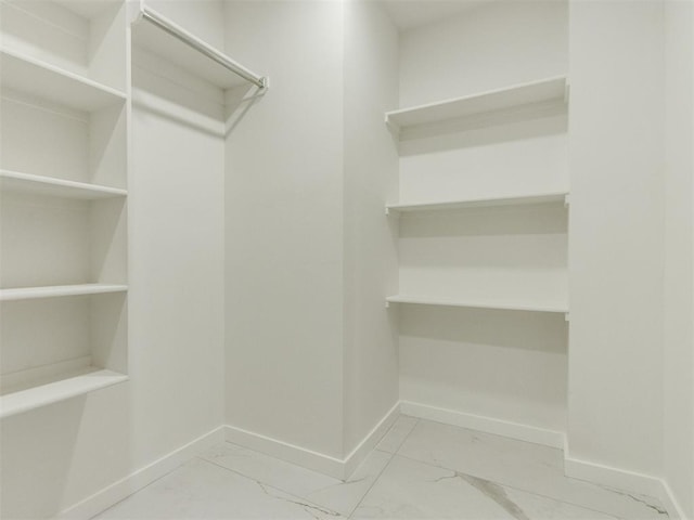 426 NW 115th St, Oklahoma City, OK 73114 - spacious closet featuring marble look tiles