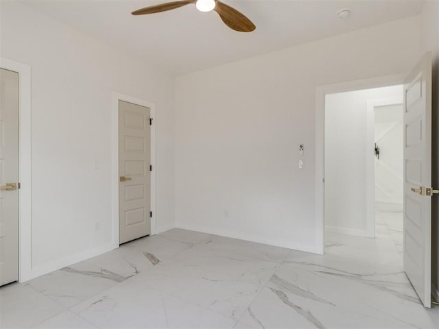 426 NW 115th St, Oklahoma City, OK 73114 - unfurnished room with light marble finish flooring and a ceiling fan